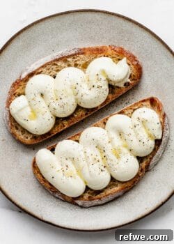 whipped ricotta with olive oil and pepper on two slices of toast