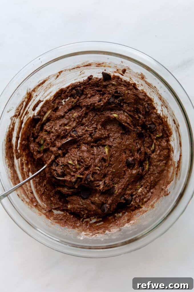 Wholesome Cocoa Zucchini Muffins 9 Close-up of the ready-to-bake chocolate zucchini muffin batter in a mixing bowl.