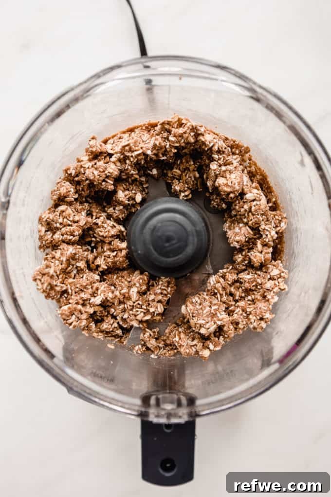 The crisp topping mixture after being pulsed in a food processor, showing a perfect crumbly texture.