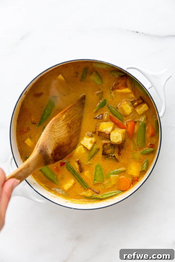 Quick and Creamy Thai Massaman 11 A large pot filled with rich and creamy Massaman curry, showcasing its vibrant color and inviting texture.