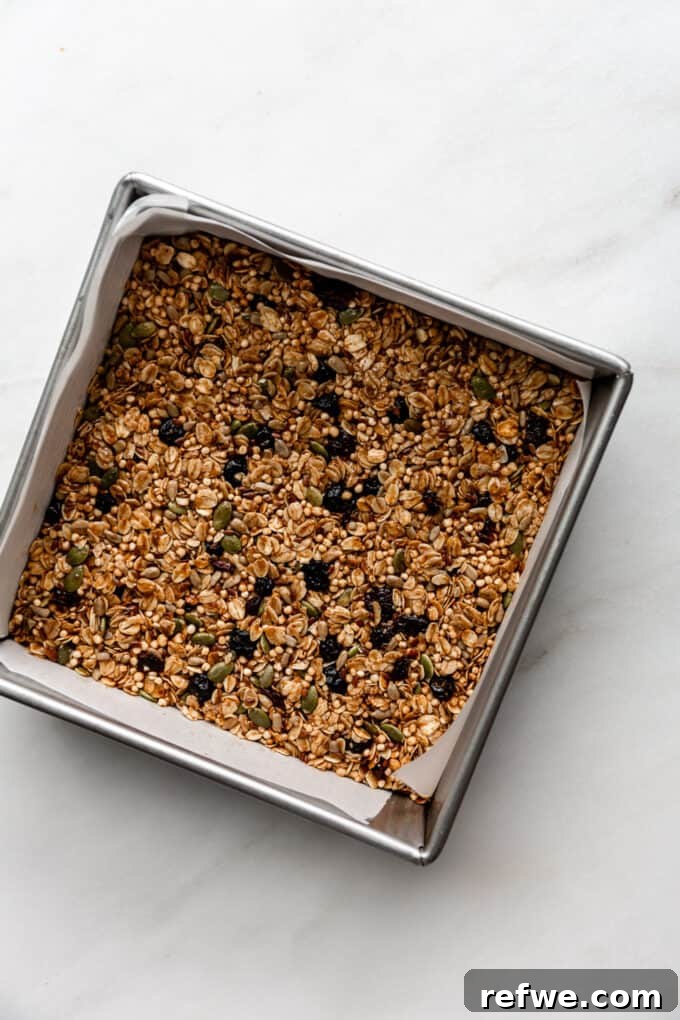 Nourishing Homemade Granola Bars 11 baked granola bars in a pan