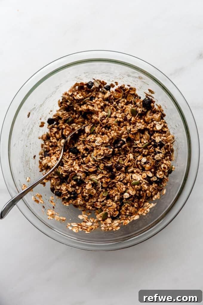 Nourishing Homemade Granola Bars 9 mixed granola in a clear bowl