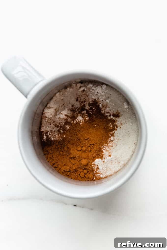 Warm Pumpkin Spice Mug Bliss 3 Dry ingredients: sugar, spices, and flour mixed together in a mug