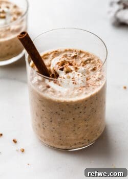 pumpkin overnight oats with a cinnamon stick in it