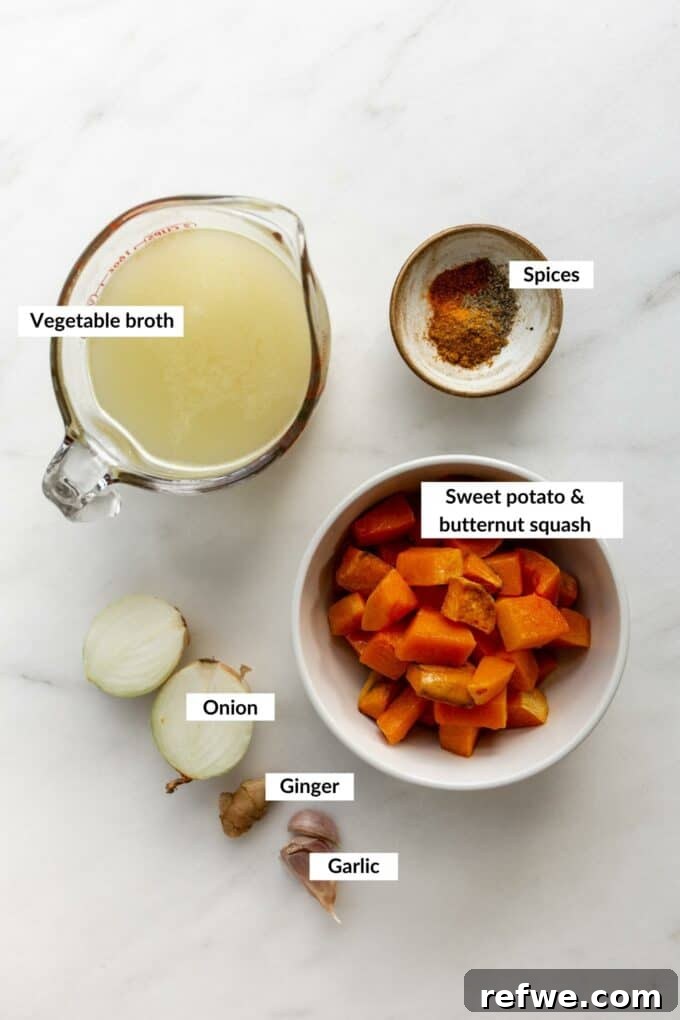 a flat lay photo displaying all fresh ingredients for curried butternut squash sweet potato soup