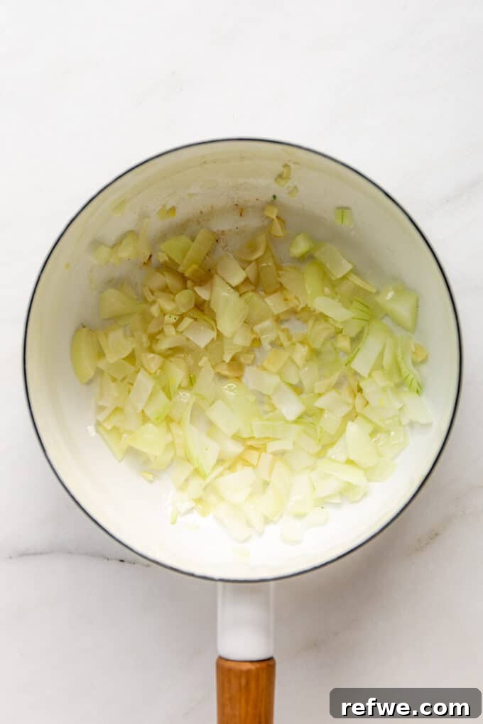Wholesome Broccoli Potato Potage 4 Chopped garlic and onions sizzling in olive oil in a white pot