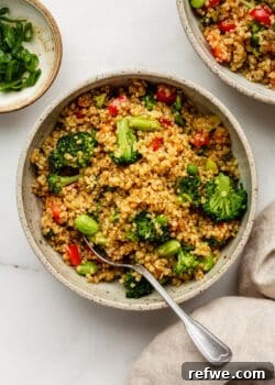 Quinoa fried rice with vegetable in a bowl with a spoon