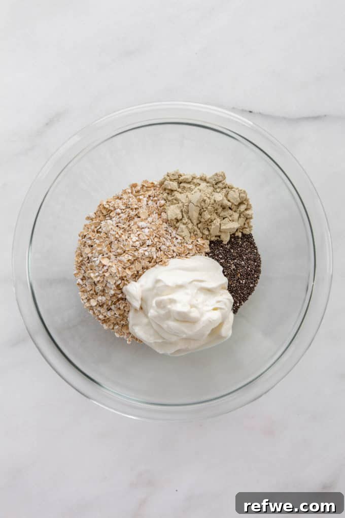 oats, protein powder, chia seeds and yogurt in a mixing bowl