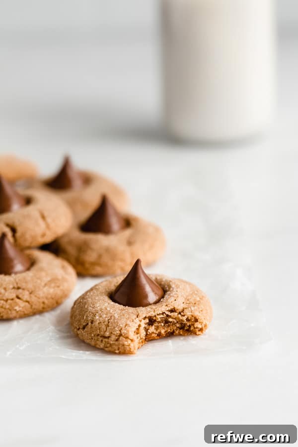 Festive & Fit: 18 Healthier Holiday Treats 16 Classic Gluten-Free Peanut Butter Blossoms, adorned with a chocolate kiss in the center, a chewy, sweet, and grain-free healthy holiday cookie.