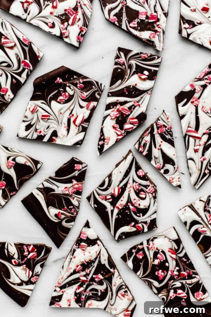 Festive & Fit: 18 Healthier Holiday Treats 10 Visually stunning Marbled Peppermint Bark, with layers of white and dark chocolate swirled and topped with crushed peppermint, a simple healthy holiday treat.