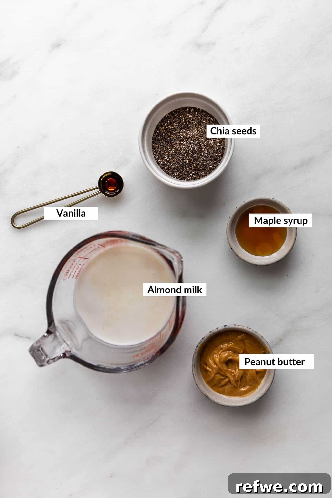 Creamy Peanut Butter Chia Pudding 3 A selection of key ingredients for peanut butter chia pudding, including natural peanut butter, chia seeds, and plant-based milk.