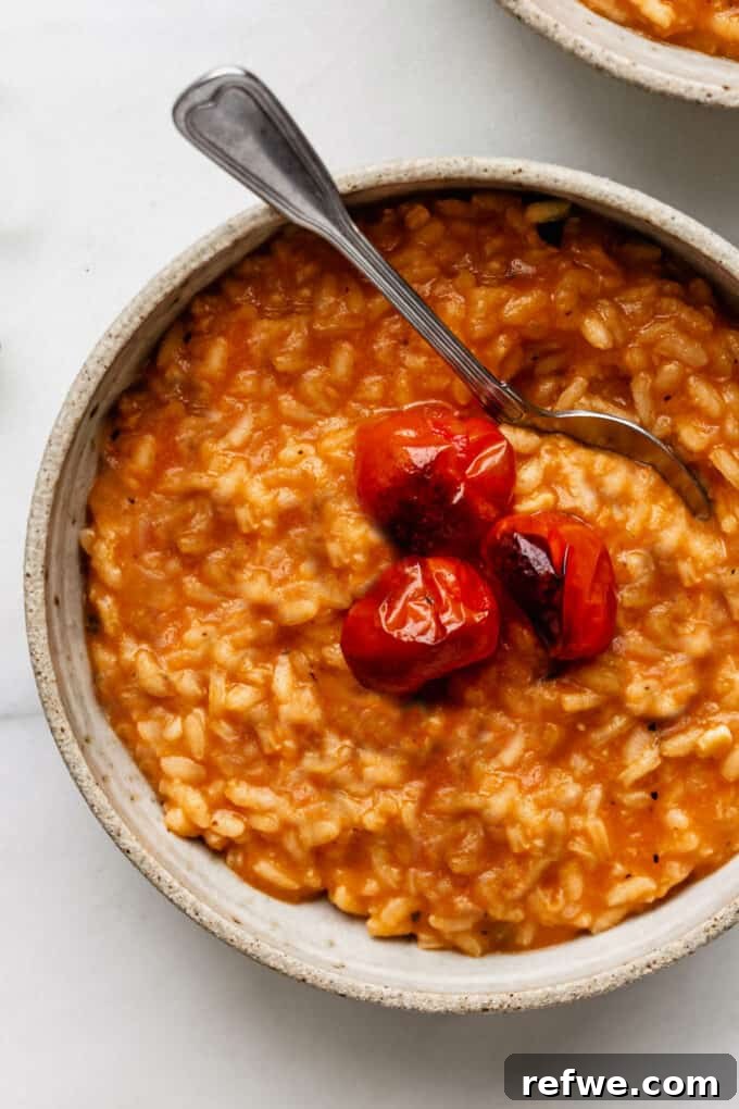 Romantic Tomato Risotto for Two 2 A bowl of creamy tomato risotto topped with roasted cherry tomatoes and fresh basil