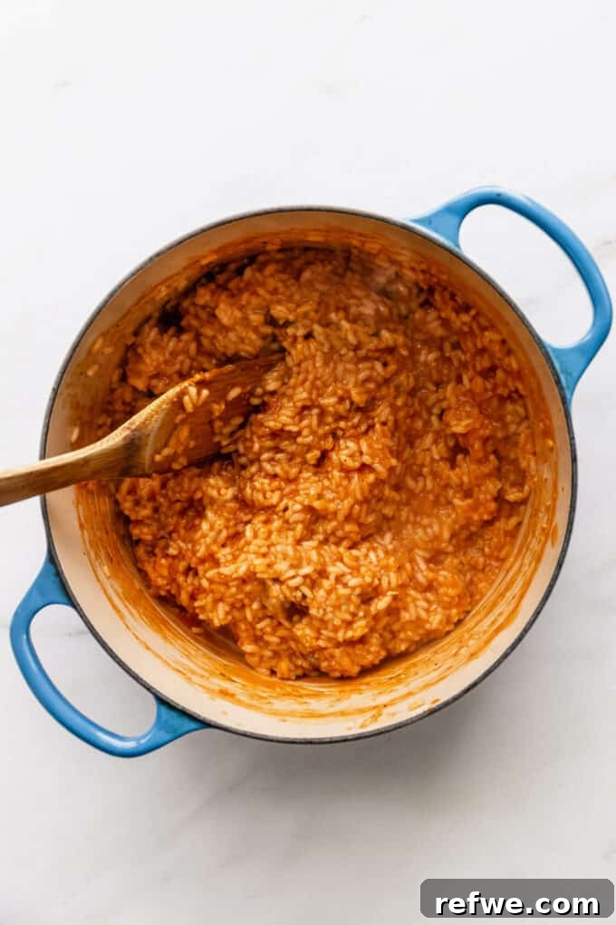Romantic Tomato Risotto for Two 9 Creamy tomato risotto resting in a blue pot