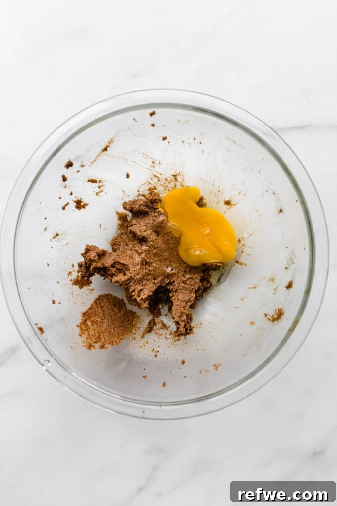 beaten butter and sugar in a mixing bowl with an egg added