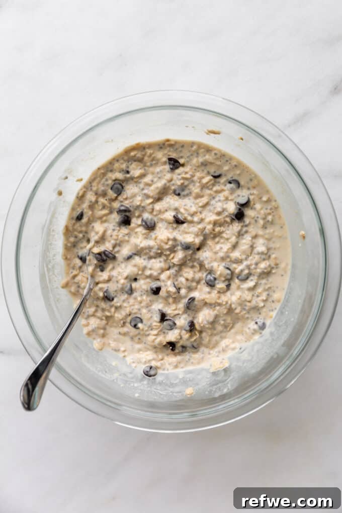 Dreamy Cookie Dough Oats 8 Chocolate chips folded into the cookie dough overnight oats mixture in a bowl.