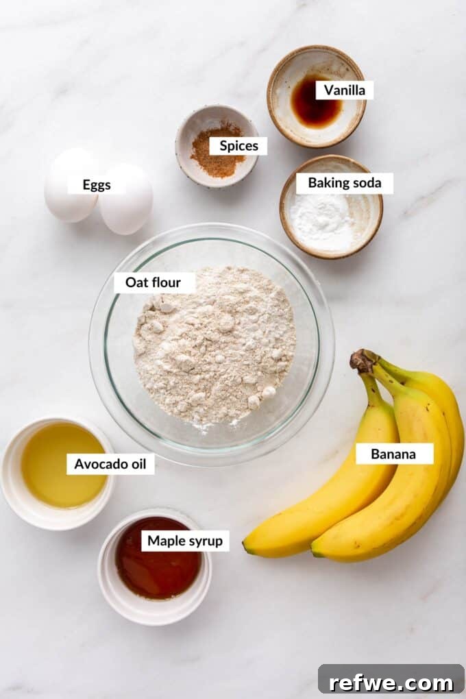 Wholesome Banana Oat Muffins 3 Ingredients laid out for making oat flour banana muffins, including bananas, eggs, oil, maple syrup, oat flour, and spices.