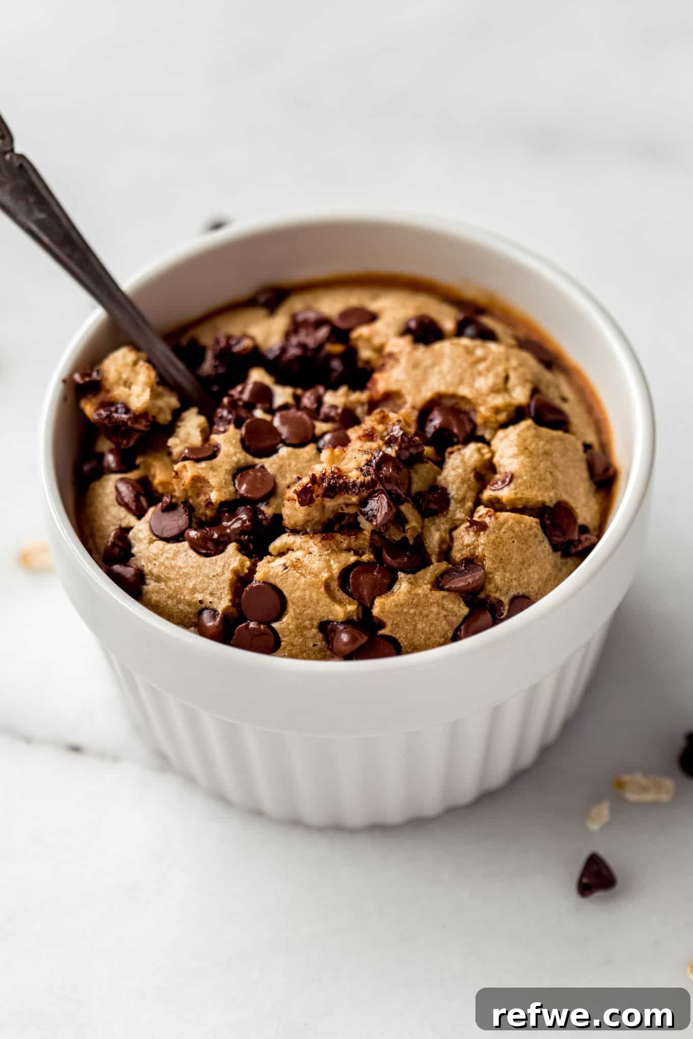 Cookie Dough Baked Oatmeal 9 Close-up of baked cookie oatmeal with rich chocolate chips melted throughout, perfect for a cozy morning