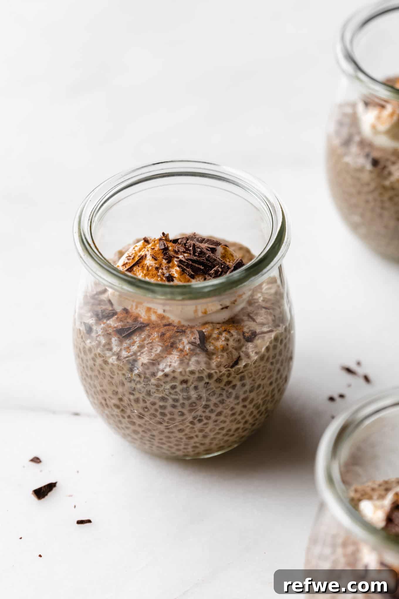 Decadent Coffee Chia Delight 2 A jar of coffee chia pudding topped with yogurt, cinnamon, and chocolate for a healthy and delicious breakfast.