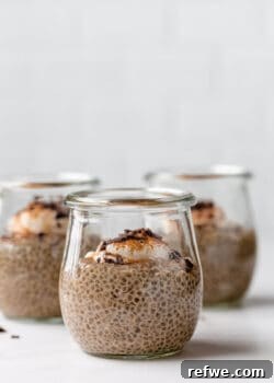 Coffee chia pudding in 3 small jars topped with yogurt and cinnamon