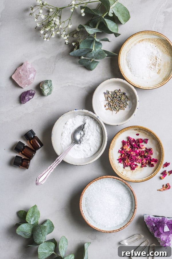 Elevate Your Bath: Homemade Aromatherapy Salt Creations 3 Three jars of homemade aromatherapy bath salts, featuring dried lavender and rose petals, ready to enhance your relaxing bath experience. Made with Epsom salt and essential oils for ultimate stress relief.
