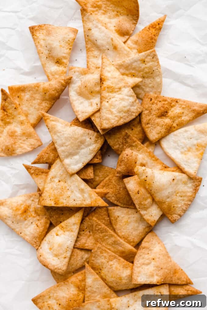 Golden Crisp Air Fryer Tortilla Chips 7 air fryer tortilla chips on parchment paper