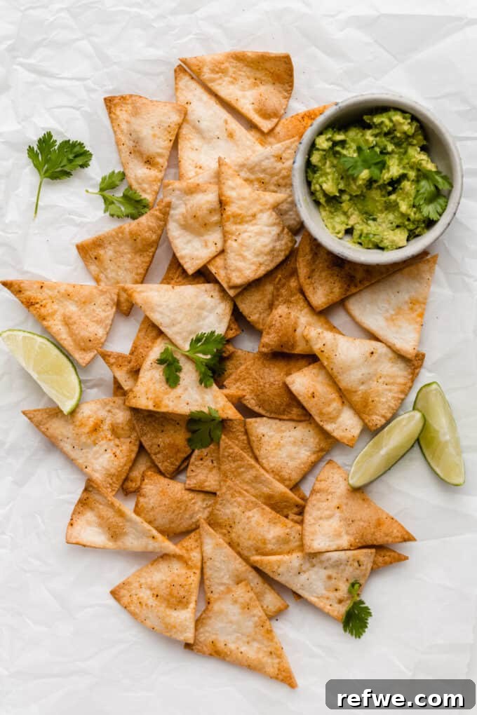 Golden Crisp Air Fryer Tortilla Chips 8 air fryer tortilla chips with a bowl of guacamole on the side