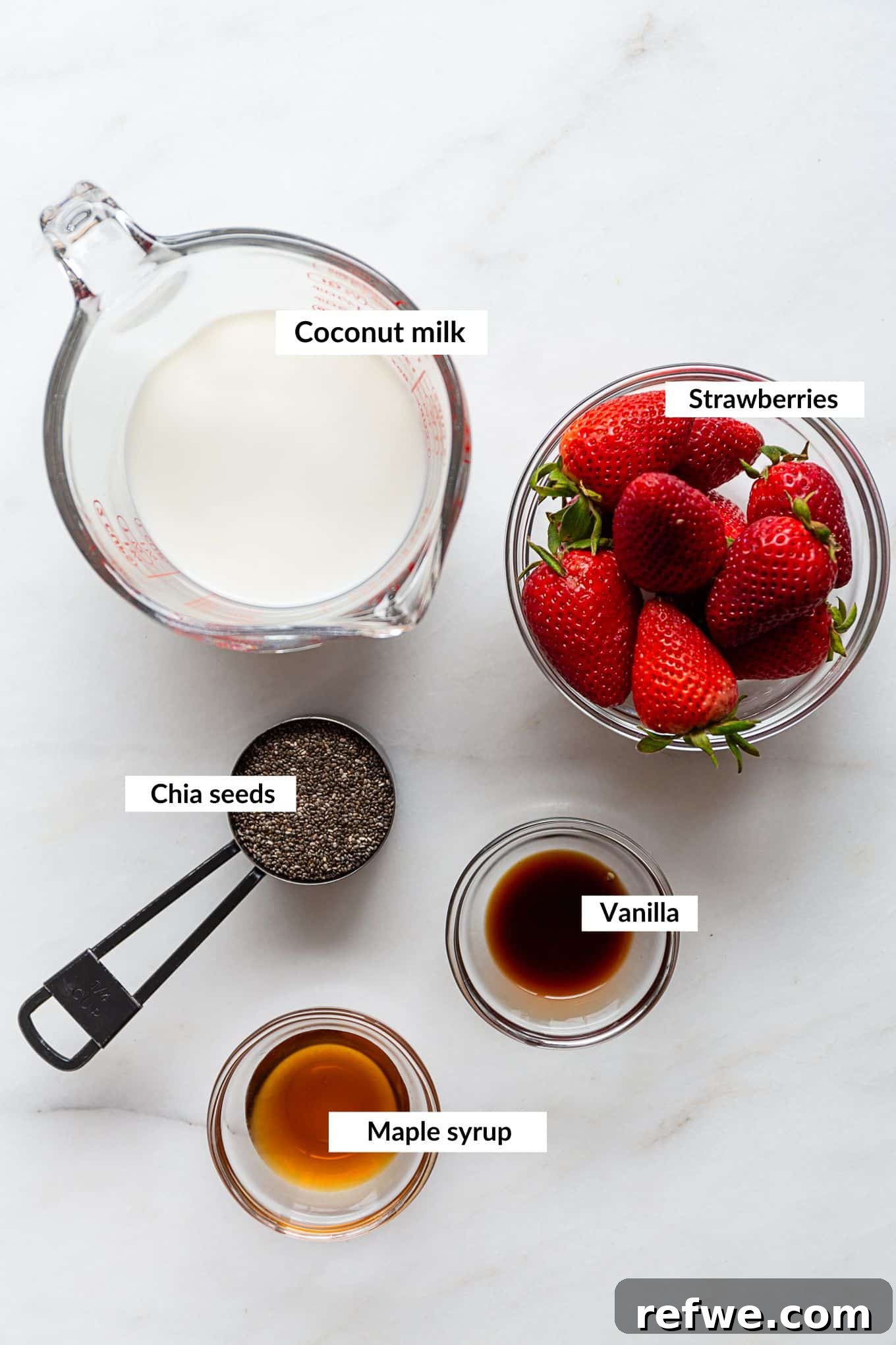 Strawberry Chia Delight 3 Fresh ingredients for strawberry chia pudding including strawberries, milk, and chia seeds