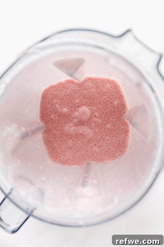 Strawberry Chia Delight 5 Blended strawberry milk in a blender