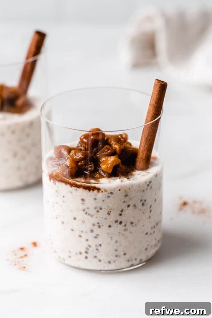 Savor the Season: 14 Fall Apple Recipes 2 Creamy Apple Pie Overnight Oats topped with stewed apples and a sprinkle of cinnamon, served in a clear glass jar, perfect for a healthy fall breakfast.