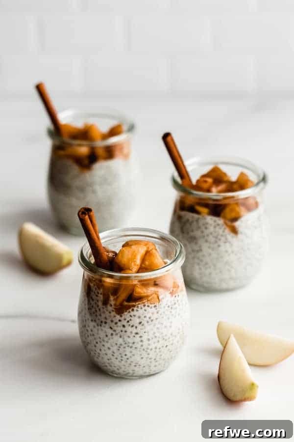 Savor the Season: 14 Fall Apple Recipes 4 Creamy Cinnamon Apple Pie Chia Pudding topped with fresh apple slices and a dusting of cinnamon, presented in an elegant glass jar.
