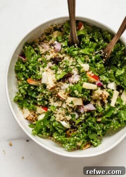 A beautiful Apple Cranberry Quinoa Salad in a white bowl, ready to be enjoyed.