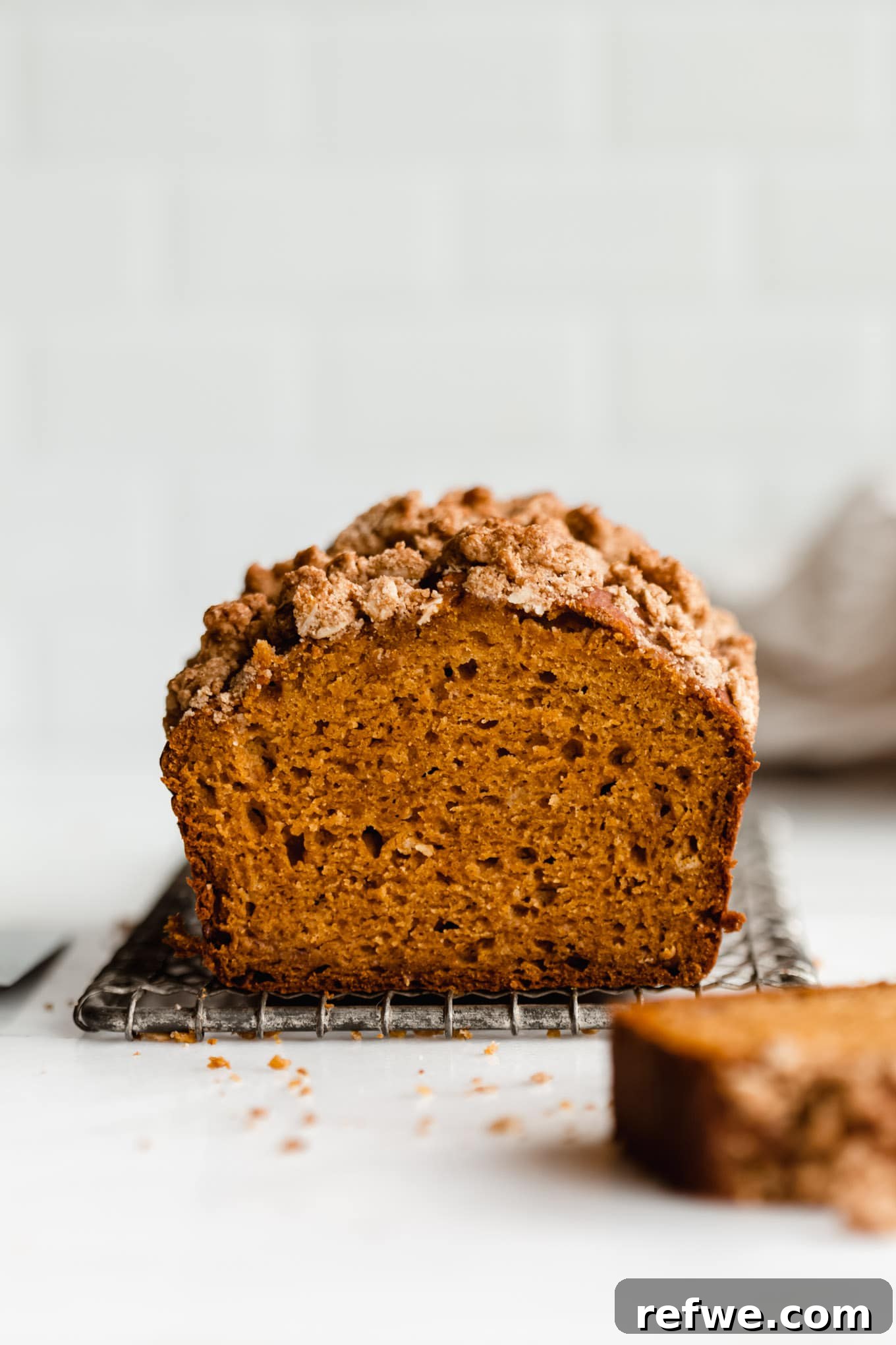 Wholesome Pumpkin Banana Loaf 11 A pumpkin banana bread loaf on a cooling rack