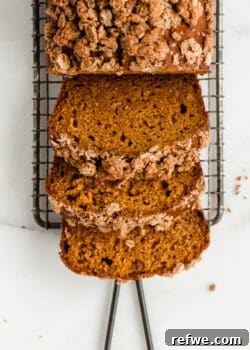 three slices of pumpkin banana bread with streusel topping