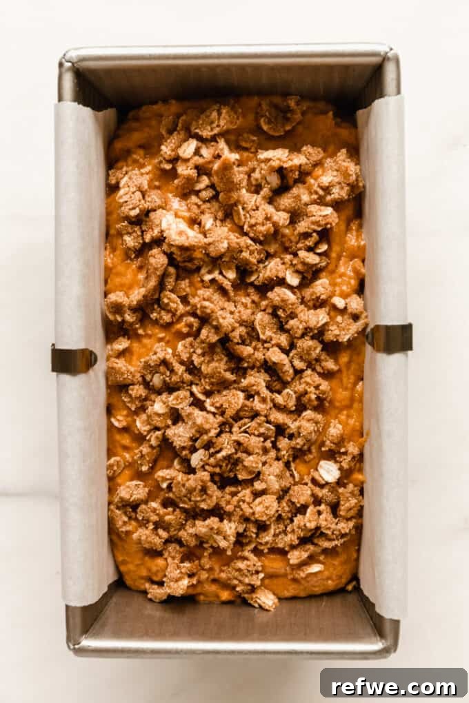 Wholesome Pumpkin Banana Loaf 9 pumpkin banana bread batter with streusel topping in a loaf pan