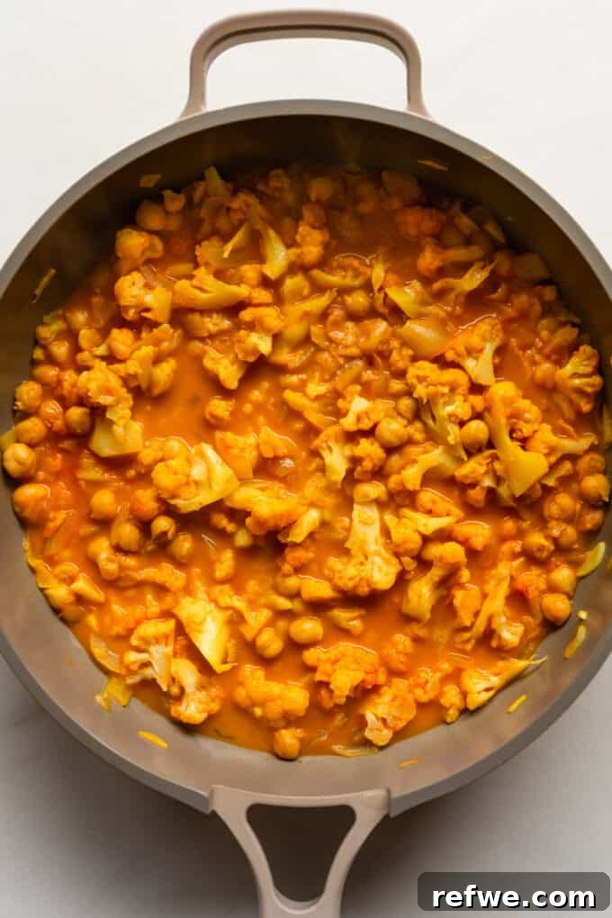 Golden Cauliflower Chickpea Curry 6 cauliflower curry in a pan