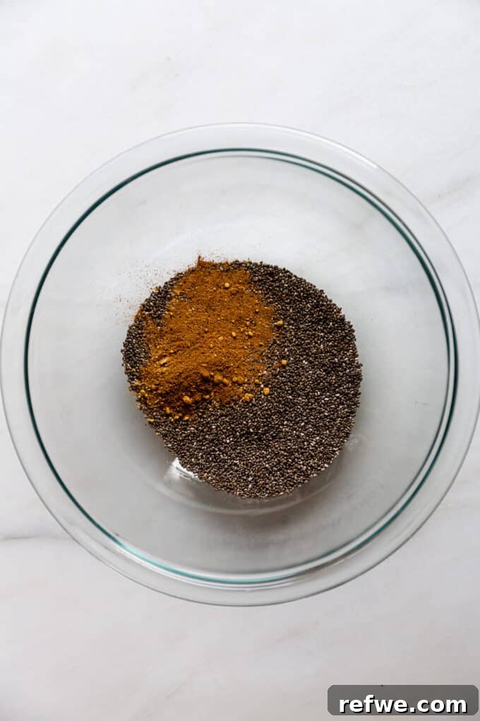Gingerbread Spice Chia Delight 3 Chia seeds and a blend of gingerbread spices are visible in a clear mixing bowl, ready to be combined with liquids.