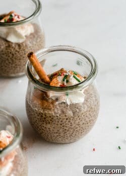 A jar of gingerbread chia pudding with red and green sprinkles