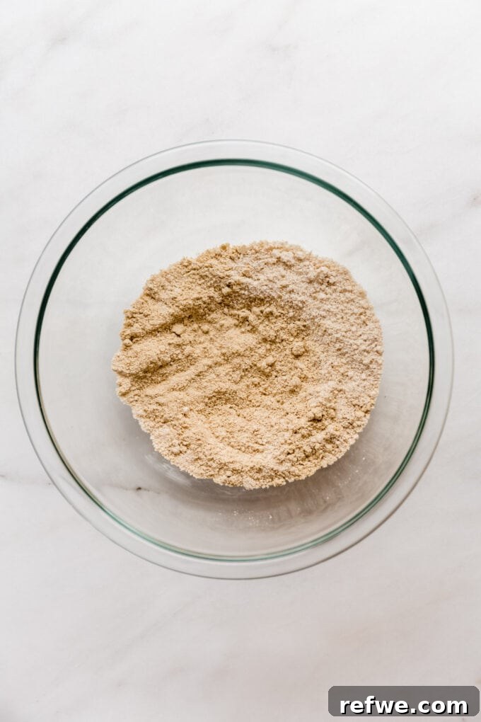 The Ultimate Homemade Snack Bars 4 Almond flour and protein powder in a mixing bowl