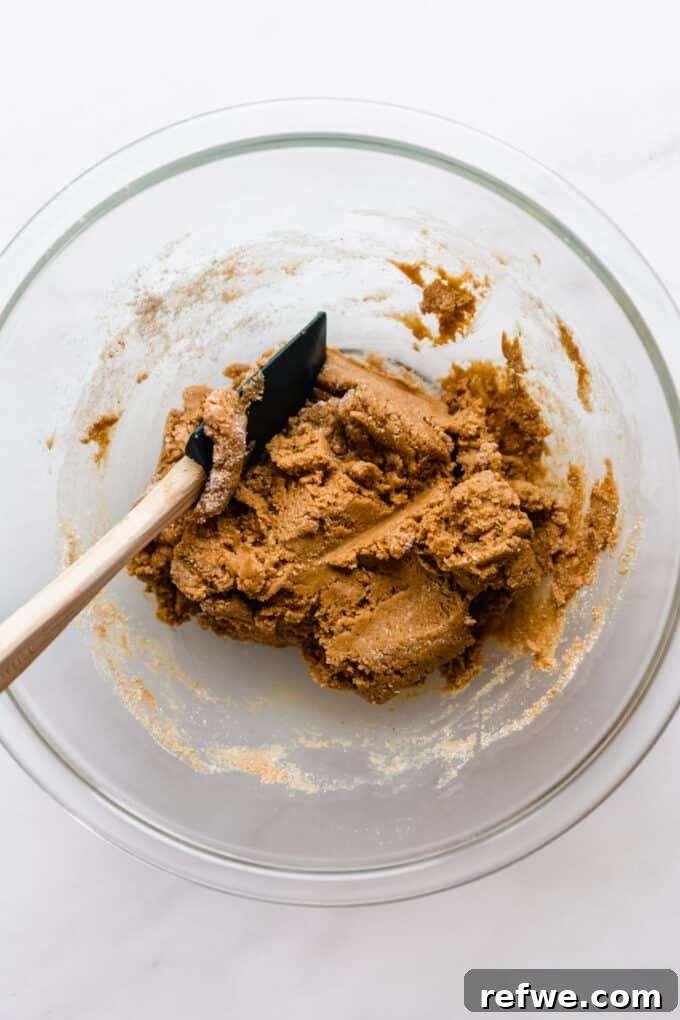 The Ultimate Homemade Snack Bars 6 Protein bar dough in a mixing bowl, ready for chocolate chips