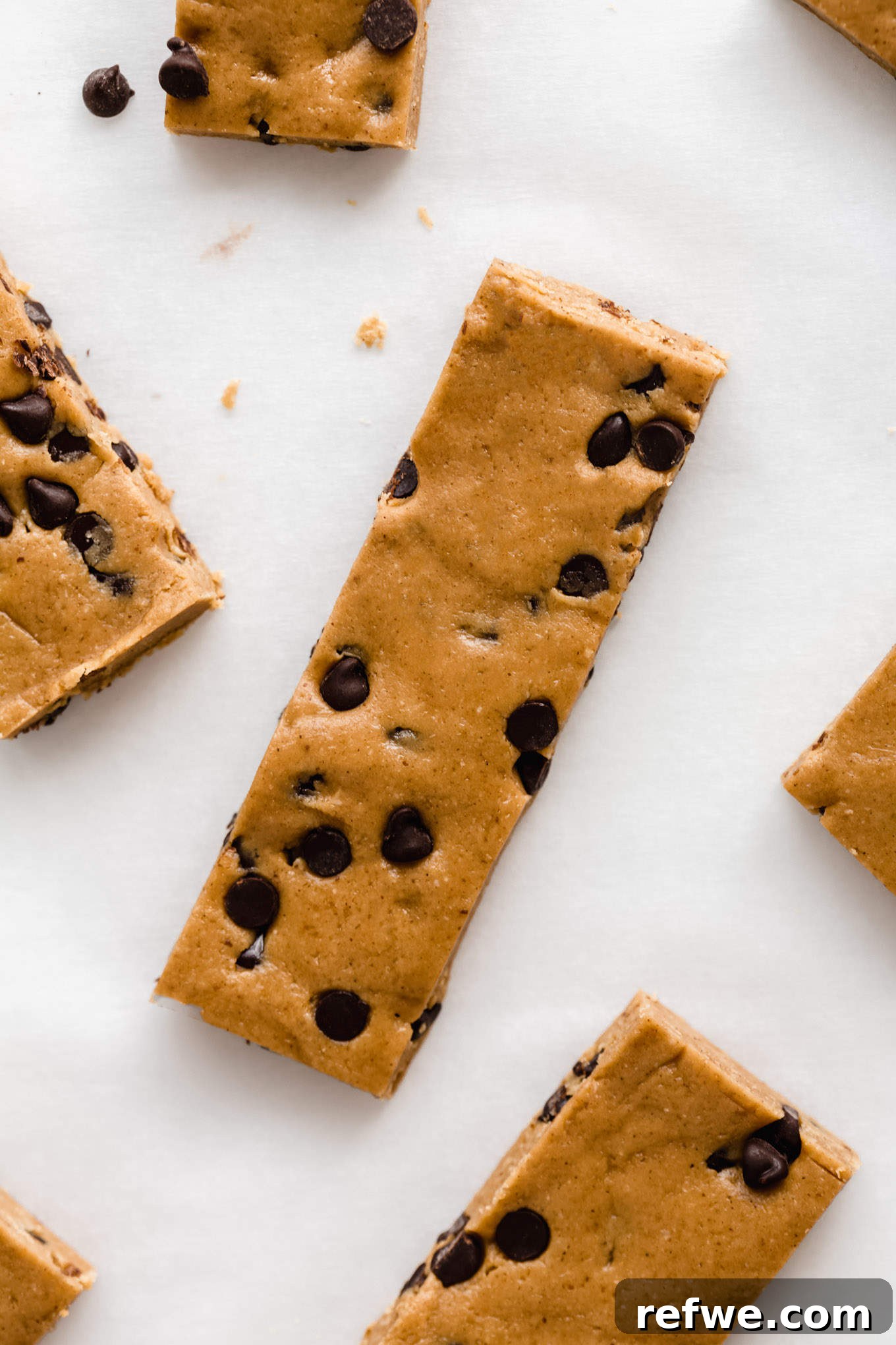 The Ultimate Homemade Snack Bars 10 A single homemade perfect bar with chocolate chips on a marble board, ready to be enjoyed