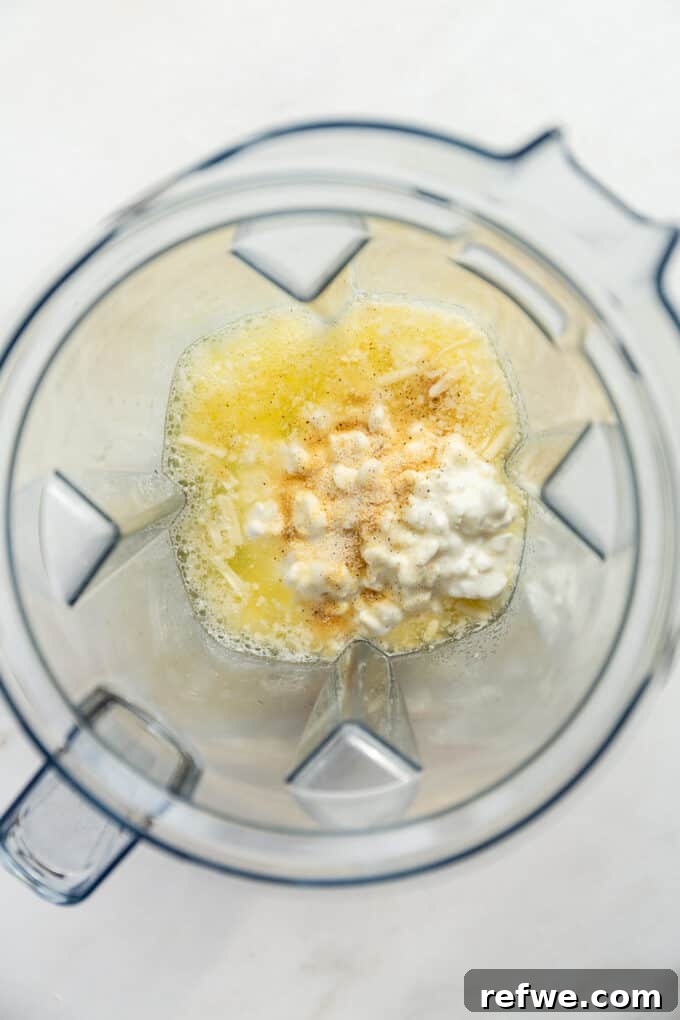 Lean Protein Egg Cups 4 Egg whites, cottage cheese, and shredded cheese being blended in a high-speed blender.