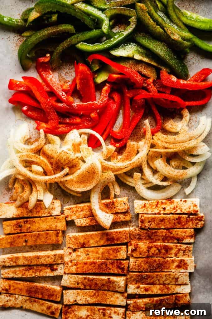 Sizzling Tofu Fajitas 5 sliced tofu, onions and red and green peppers on a baking sheet