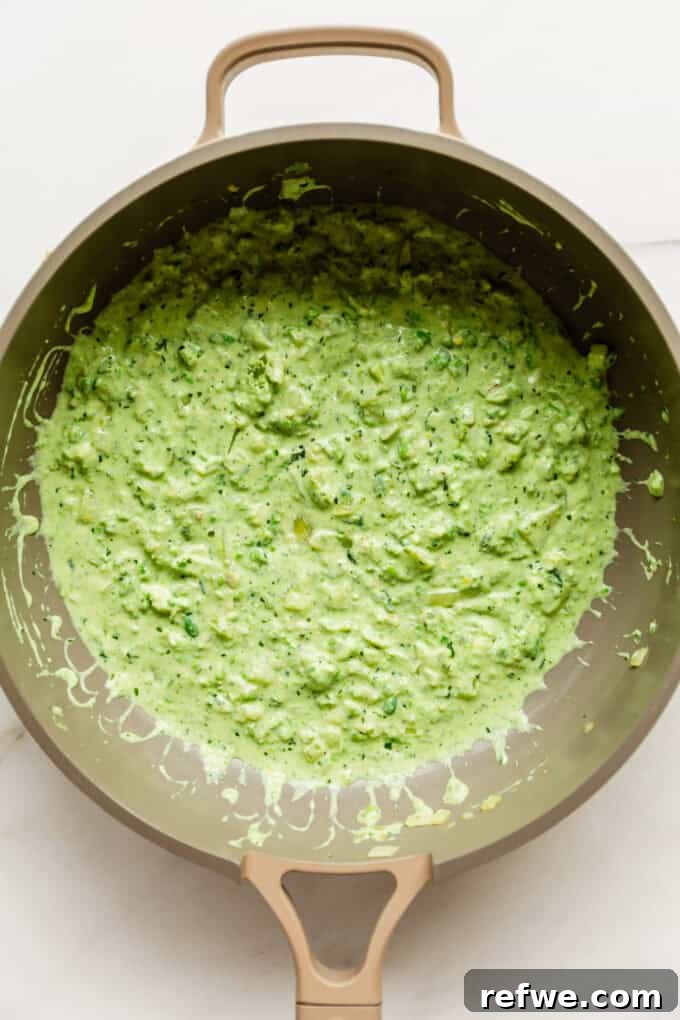 Spring Pea Ricotta Pasta 7 The creamy ricotta and pea sauce simmering in a pan, blended to perfection.