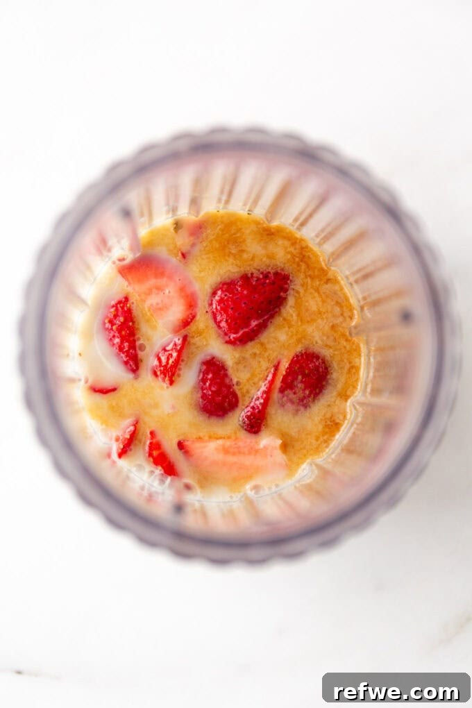 Dreamy Strawberry Overnight Oats 4 Almond milk, fresh strawberries, maple syrup, and vanilla extract are added to a blender for the strawberry milk base.