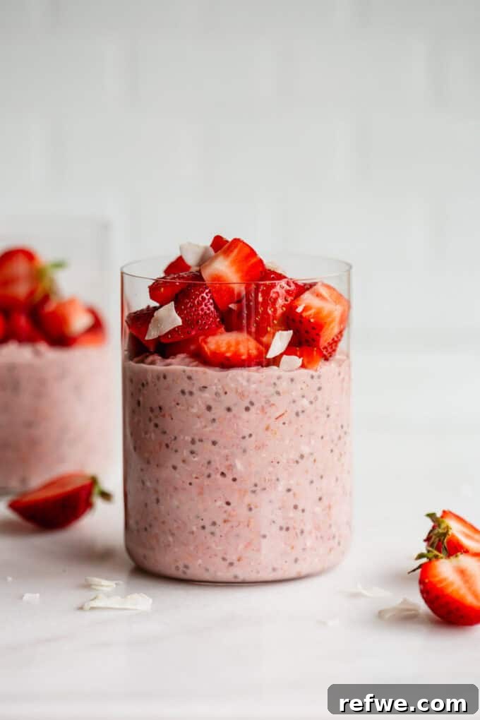 Dreamy Strawberry Overnight Oats 9 A jar of delicious strawberry overnight oats, topped with fresh strawberry slices, ready to be enjoyed as a refreshing breakfast.