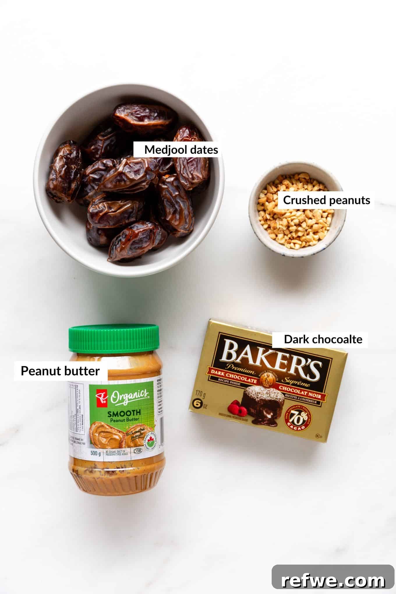 Snickers Dream Dates 3 A vibrant flat lay image showcasing the simple yet essential ingredients for making healthy Snickers stuffed dates: luscious Medjool dates, creamy peanut butter, crunchy crushed peanuts, and rich dark chocolate.