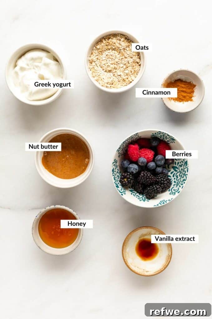 A collection of ingredients laid out on a table, ready to be used for making frozen yogurt granola cups.