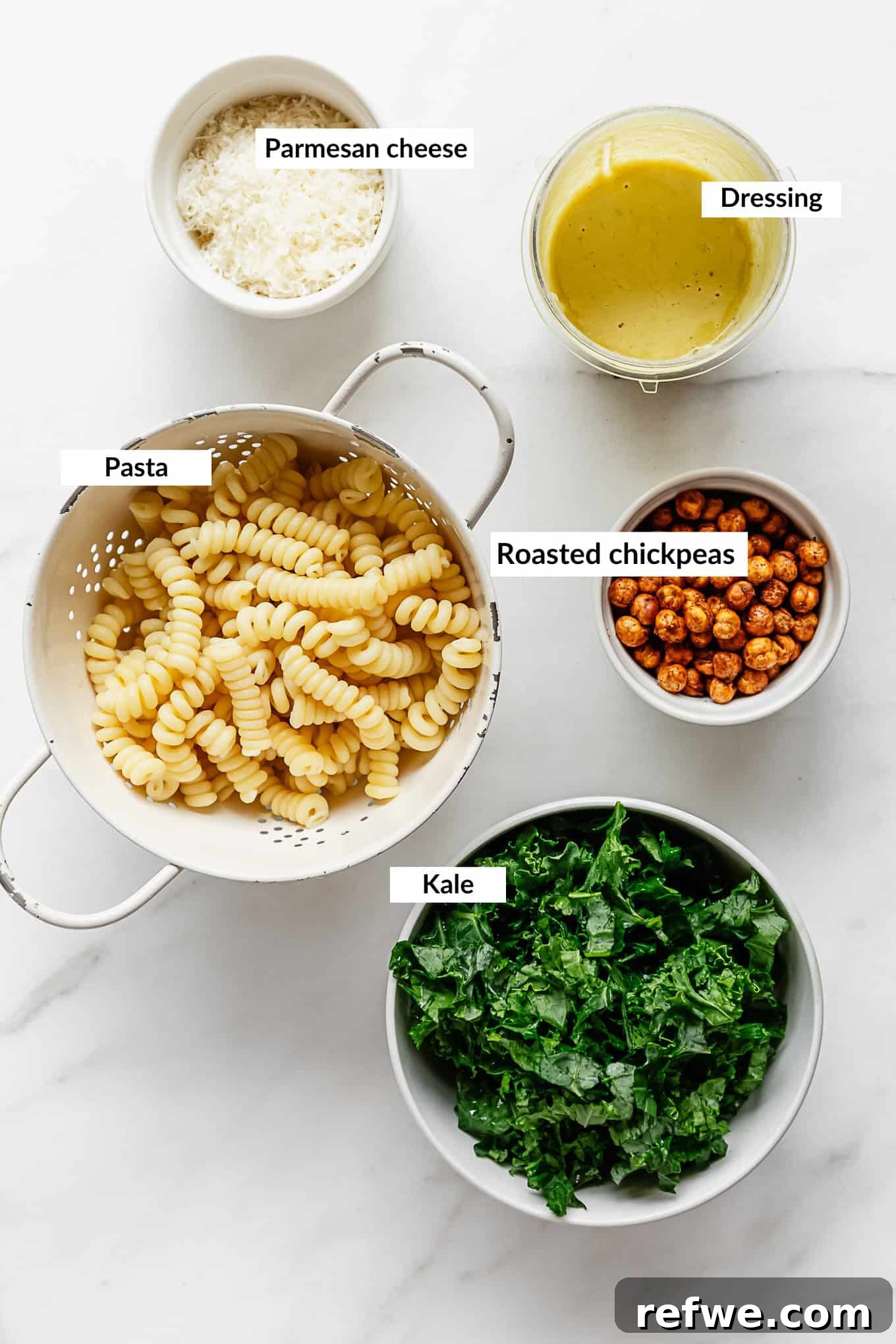 Caesar's Hearty Kale Pasta 3 A vibrant flat lay showcasing all the fresh ingredients needed for a delicious kale caesar pasta salad.
