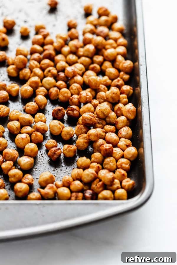 Caesar's Hearty Kale Pasta 5 Golden-brown, perfectly roasted crispy chickpeas cooling on a baking tray after being removed from the oven.