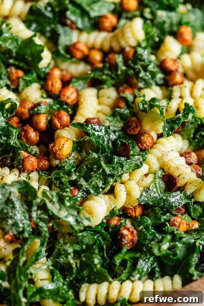 Caesar's Hearty Kale Pasta 10 A close-up view of the finished Kale Caesar Pasta Salad, showing the texture and vibrant ingredients.